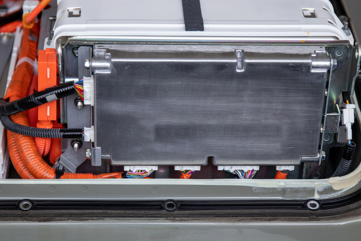 Close-up of lithium battery control unit and lithium battery inside an electric car, showcasing the technology behind sustainable transportation. Close-up of lithium battery control unit and the thermal propagation barriers contained within