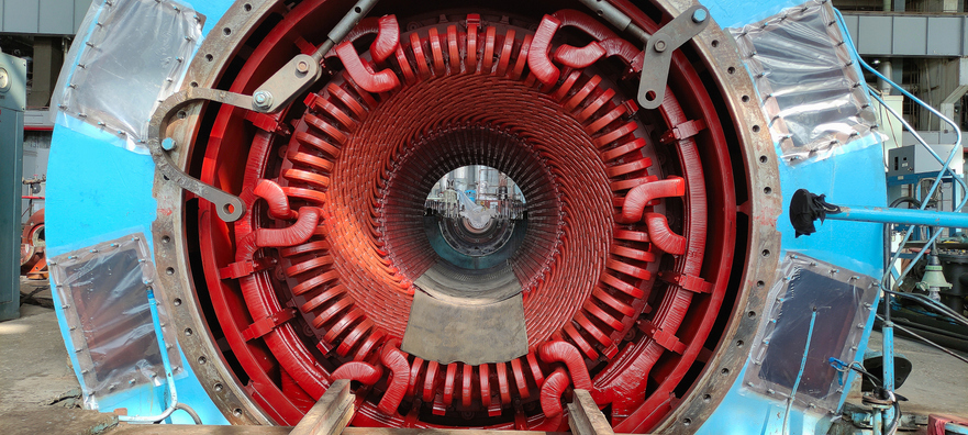 power generator of industrial steam turbine in reparation process at thermal electric power plant coil insulation shown on an industrial power generator