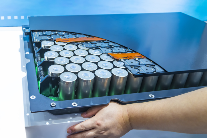 hand with Lithium ion industrial high current batteries and connector custom electrical insulation helps across a variety of applications including lithium ion industrial high current batteries